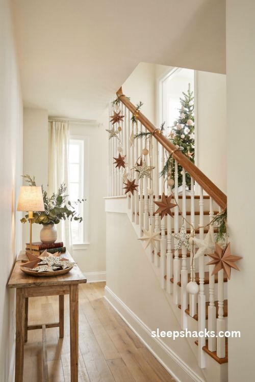 Handmade Christmas staircase garland with kraft paper stars felt shapes wooden beads and natural twine