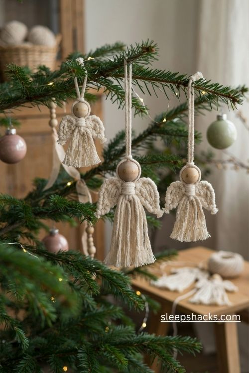 Handmade macrame angel Christmas ornaments with wooden bead heads and soft ivory fringe wings
