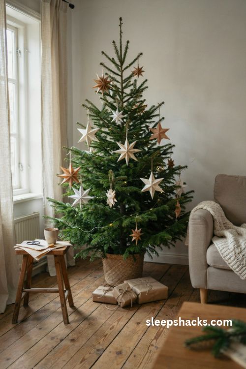 Handmade paper star Christmas tree with kraft paper decorations and warm white lights