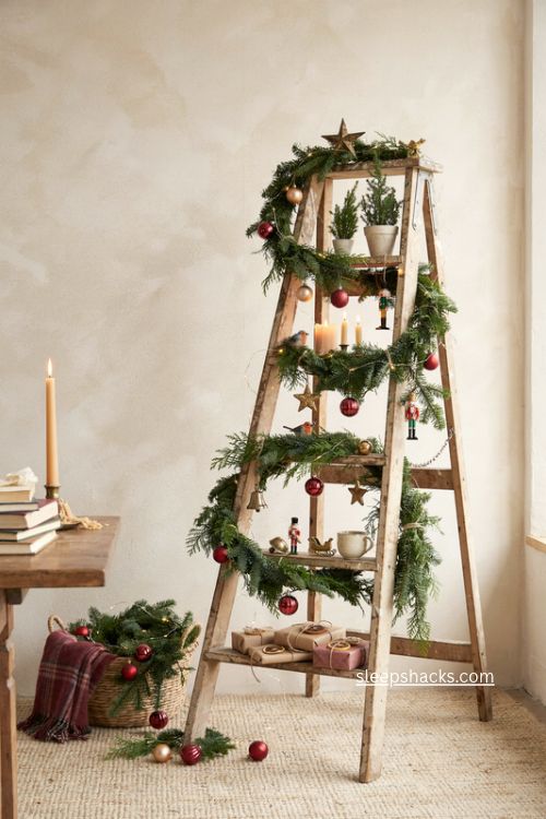 Leaning ladder christmas tree with garland ornaments candles and gifts in rustic cottage living room 