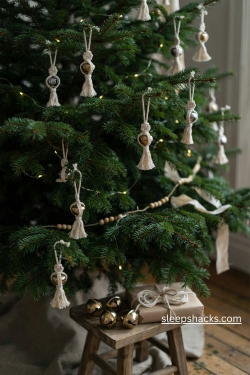 Macrame Christmas bell ornaments with cream cord fringe and warm golden jingle bells