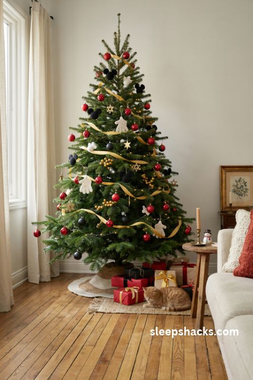 Mickey mouse christmas tree with golden yellow ornaments and white glove decorations