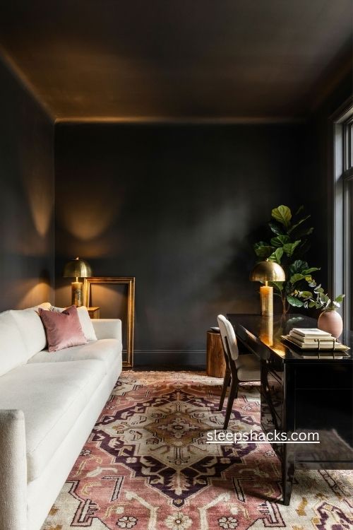 Moody black home office with white sofa lacquer desk pink and gold rug