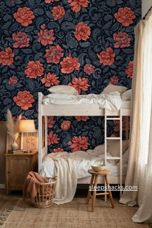 Moody boho bedroom with white bunk bed coral navy wallpaper and natural wood accents 