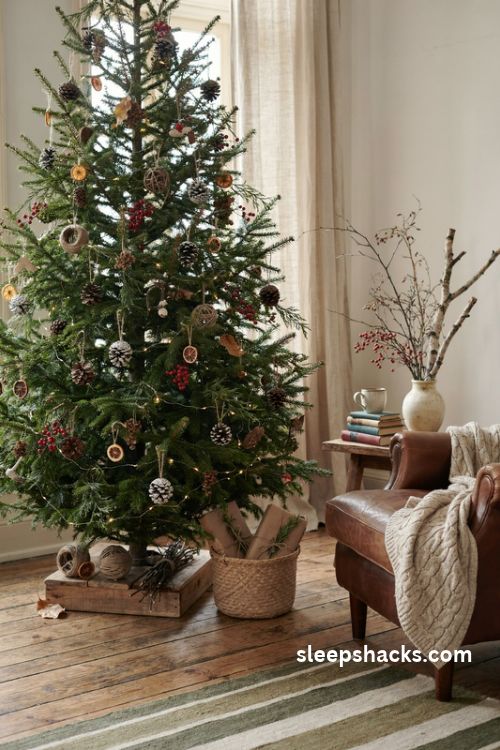 Natural foraged Christmas tree with pinecones dried seed pods twine and rustic woodland ornaments