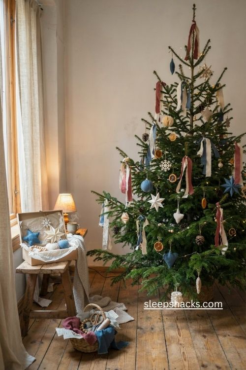 Organic Christmas tree with handmade paper tinsel denim ornaments and recycled holiday decor