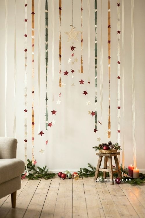 Paper garland wall christmas tree with handmade stars and rustic ornaments 