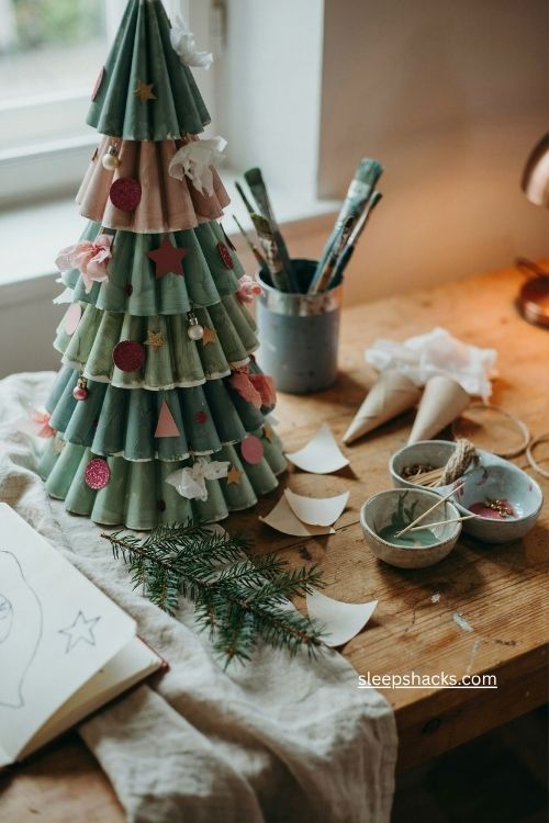 Paper plate christmas tree with handmade green layers and cozy holiday craft decor
