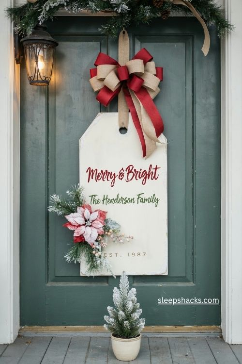Personalized tag shaped Christmas door hanger with flocked florals and poinsettias