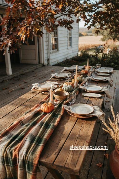 Plaid blanket thanksgiving table runner with pumpkins and rustic patio decor