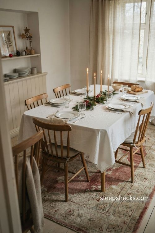 Plain white tablecloth for a simple and elegant christmas dinner table