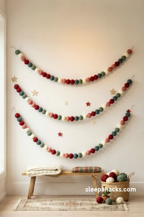Pom pom garland christmas backdrop with fluffy red white and green yarn decorations