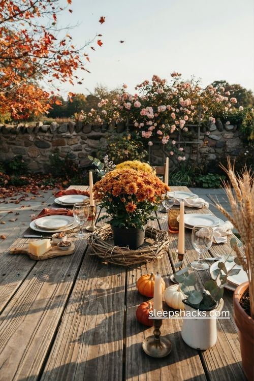 Potted mums in twig wreath thanksgiving table centerpiece with pumpkins