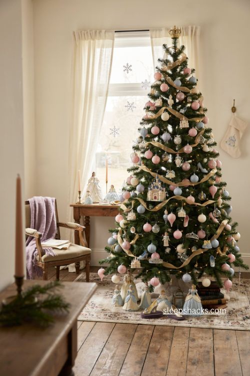 Princess castle Christmas tree with pastel ornaments crowns glass slippers and Disney decor 