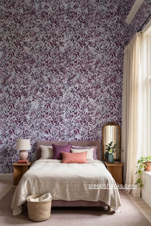 Purple bedroom with bold botanical wallpaper matching violet accents and solid lavender rug