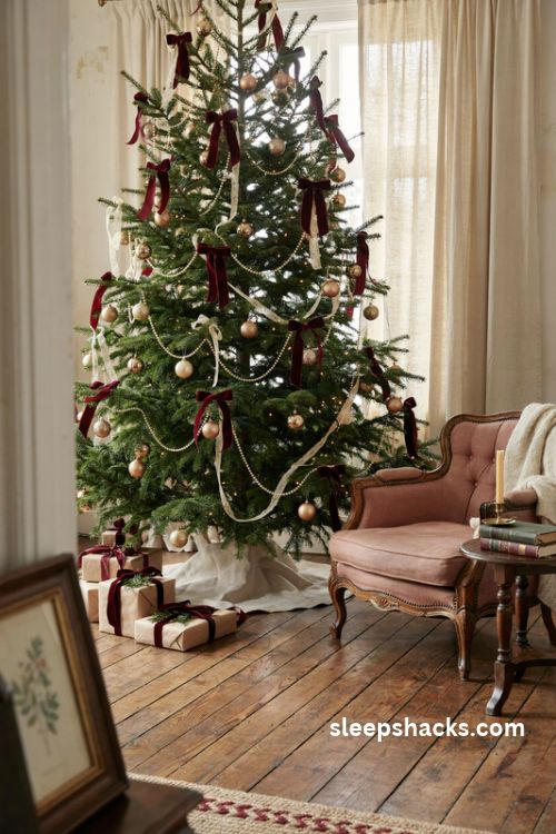 Red velvet coquette Christmas tree with cream lace pearl garlands and antique gold ornaments