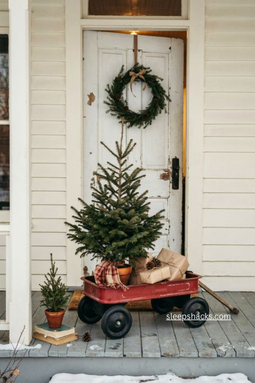Red wagon christmas tree display with plaid scarf and wrapped presents
