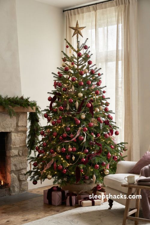 Ruby red and deep plum christmas tree with velvet ornaments and warm neutral decor