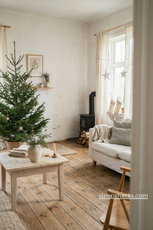 Wide-angle interior photography capturing a slim Christmas fir tree as the focal point of a cozy, light-filled Scandinavian living room, with open branches and generous breathing space between every ornament. The room feels peaceful and lived-in, with pale oak flooring, a cream linen sofa, a rustic wooden side table, and a simple woven basket holding the tree. Scandinavian minimalist Christmas styling inspired by Nordic country homes, natural craftsmanship, and timeless understated holiday traditions. A restrained palette of warm white, natural oak, soft cream, muted evergreen, and straw beige, with no bright colors or shiny metallic decorations. The slender fir is decorated sparingly with warm white fairy lights, hand-carved wooden beads, small natural wood cutout stars, tiny matte white heart ornaments, and a few delicate cream linen ribbons spaced approximately a hand's width apart. A simple woven basket or relaxed natural linen tree skirt grounds the base, while a chunky wool throw, textured linen cushions, a small ceramic vase of evergreen branches, and a handmade wooden candleholder add authentic lived-in character. Soft winter daylight enters through tall windows dressed with simple linen curtains, blending naturally with the gentle golden glow of the tree lights and candles, revealing every needle, wood grain, woven fiber, and fabric texture. A quiet, comforting Nordic Christmas atmosphere with soft colors that change the mood instantly, old textures that add warmth and depth, simple details that create lasting charm; airy, nostalgic, effortlessly beautiful, and uncluttered, celebrating the beauty of simplicity and a tree with room to breathe. no people, no text, no watermarks, no blur, no bokeh, all surfaces in sharp focus, photorealistic, ultra-realistic, 4K resolution, editorial interior photography, Pinterest-worthy, high click-through appeal.