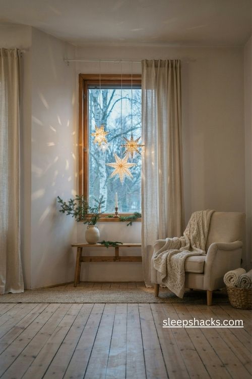 Scandi christmas paper star window lights with warm glowing folded paper lanterns