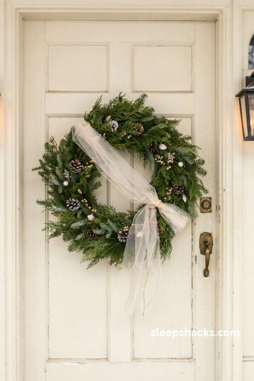 Sheer champagne glitter tulle Christmas wreath sash with frosted greenery and dreamy flowing ribbon tails