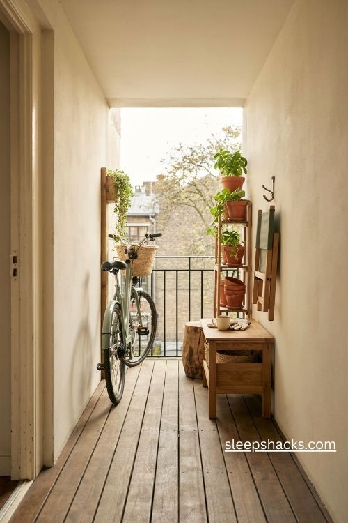 Small balcony storage ideas with vertical bike rack and space saving furniture