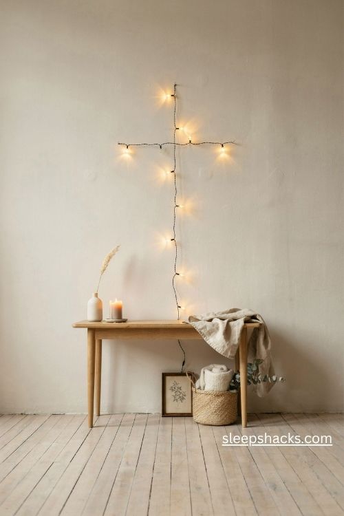String light cross christmas tree on a cozy apartment wall with warm white lights