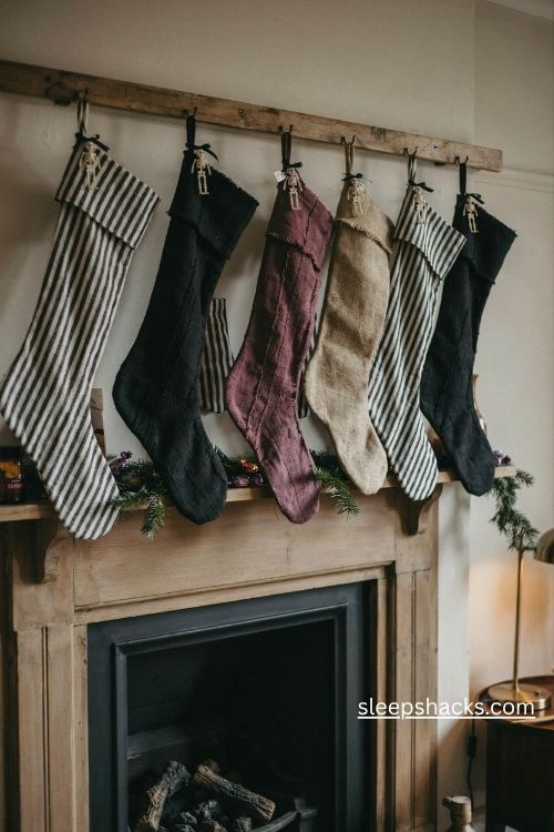 Striped black and white christmas stockings with gothic purple accents and skeleton ornaments