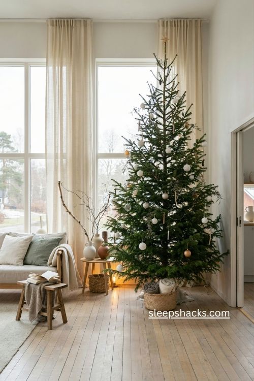Tall sparse Nordic Christmas tree high ceiling Scandinavian living room