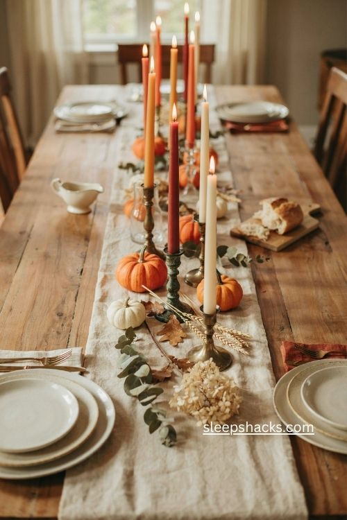 Tall taper candles in harvest colors for Thanksgiving table decor 