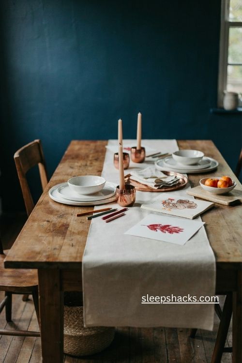 Thanksgiving kids table with midnight blue wall and ivory runner 
