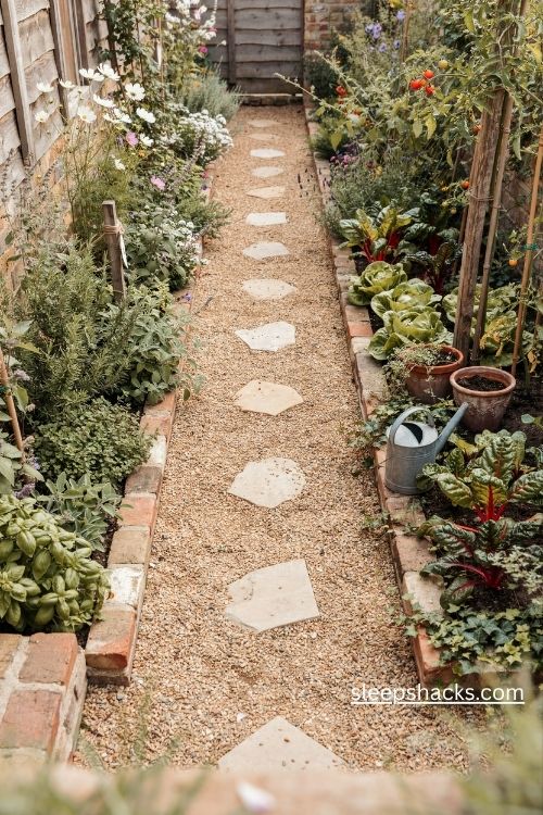 The one path small garden layout with gravel walkway and lush planting beds