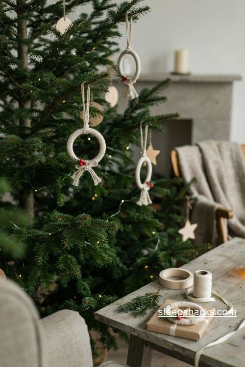 Tiny macrame wreath Christmas ornaments with ivory cotton cord red berries and rustic pine greenery