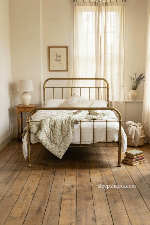Vintage bedroom with aged brass bed frame curved headboard and cozy antique details