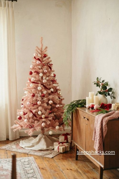 Vintage pink and red Christmas decor with blush ornaments and red velvet ribbon
