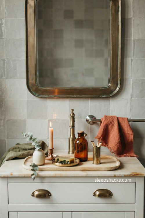 Warm brass bronze and copper accents for cozy fall bathroom decor