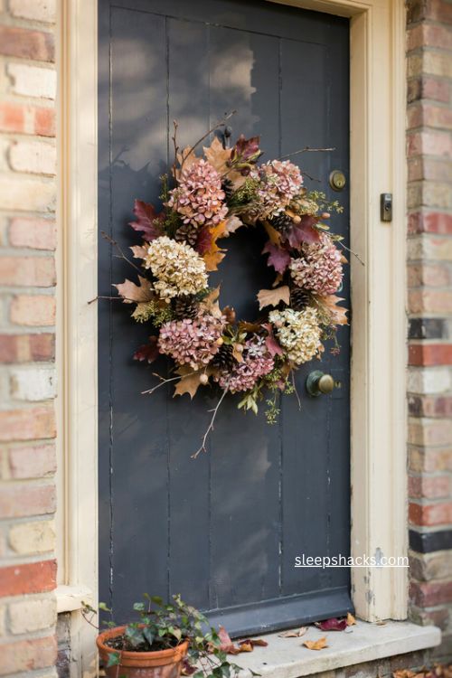 fall door decor with dried hydrangea wreath on a dark front door 