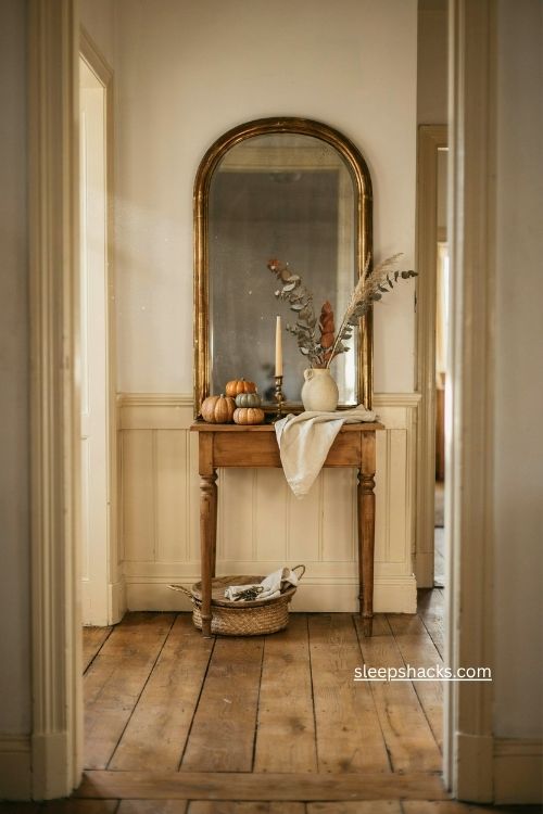 fall entry table decor with an antique gold mirror and autumn accents 