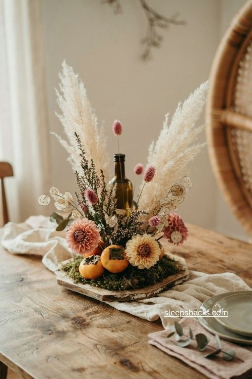 fall floral centerpiece with pampas grass dahlias lunaria and yellow persimmons 