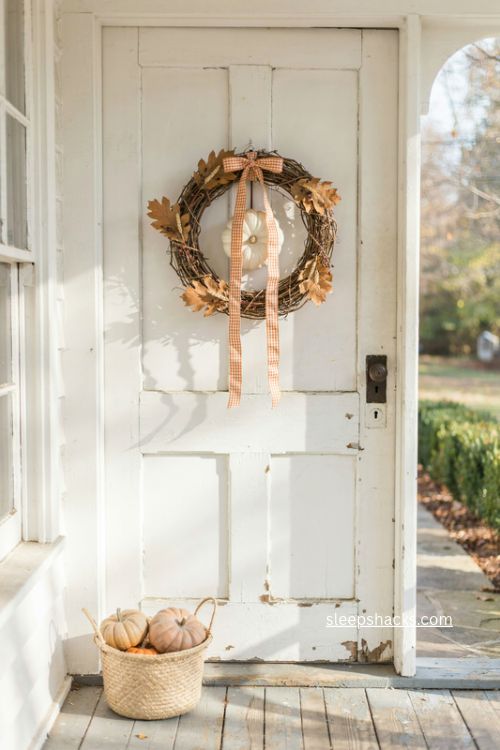 fall wreath sash door decor with orange checked ribbon white pumpkins and grapevine wreath 