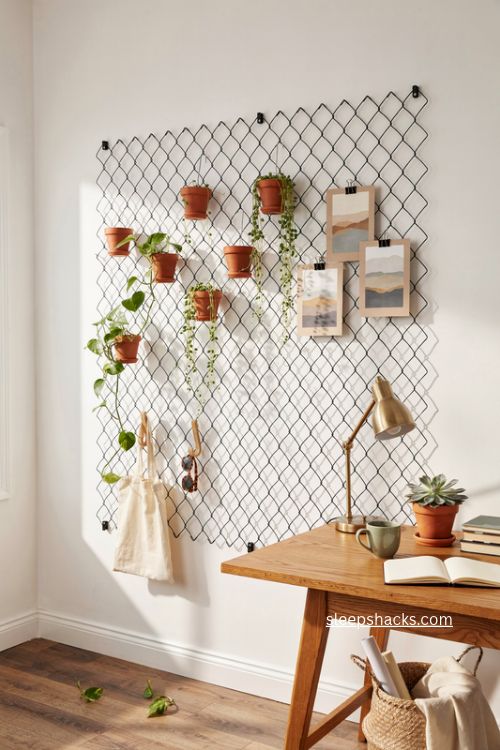 indoor hog wire wall grid with hanging plants and home office decor