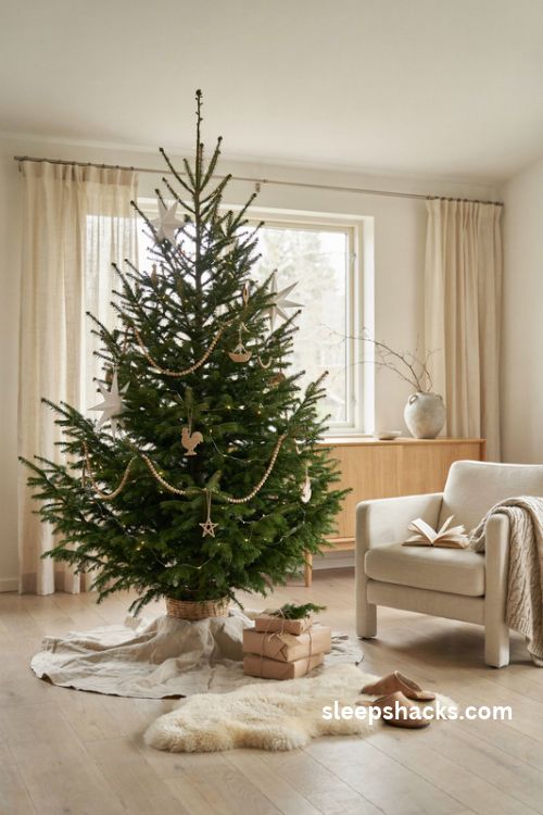 scandinavian minimalist christmas tree with wooden beads paper stars and natural linen