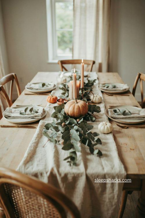 single pumpkin with eucalyptus runner simple autumn dining table centerpiece 