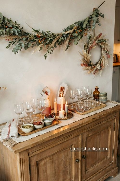 thanksgiving hosting station with wooden trays drinks and cozy fall decor 
