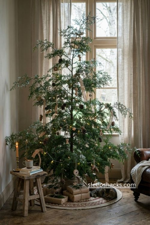 woodsy christmas tree with cedar frosted pine sprays and natural pinecones 