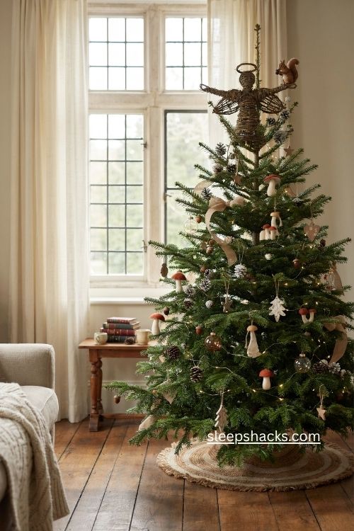 woodsy christmas tree with grapevine angel pinecone topper and woodland ornaments