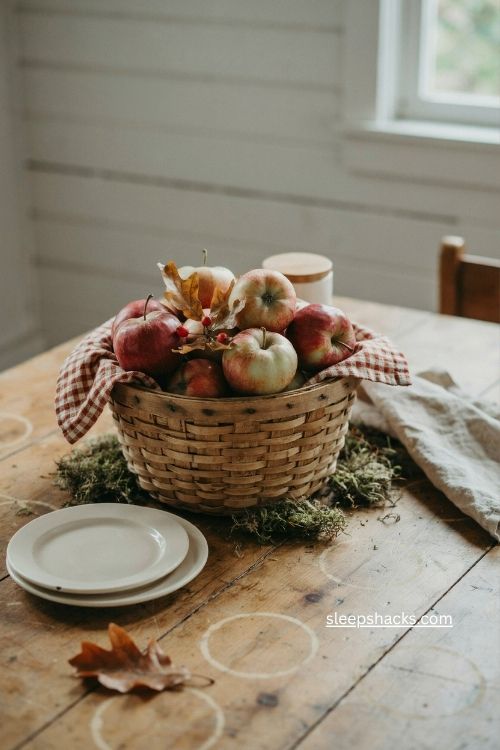 woven apple basket fall centerpiece with foliage and farmhouse table decor 